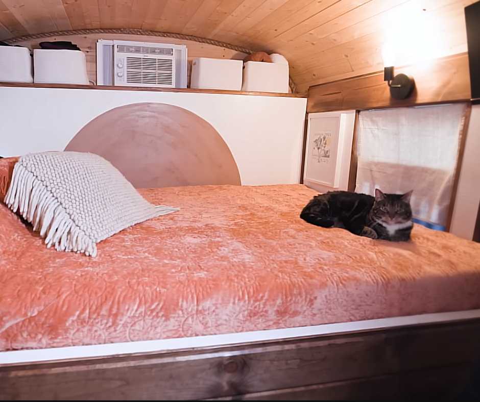 Bluebird's master bedroom with cat on bed.