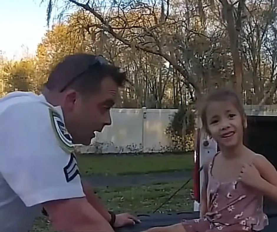 Florida officer talking to the 5-year-old girl with autism.