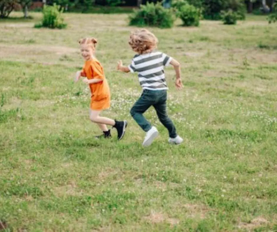 Kids chasing each other, a form of roughhousing.