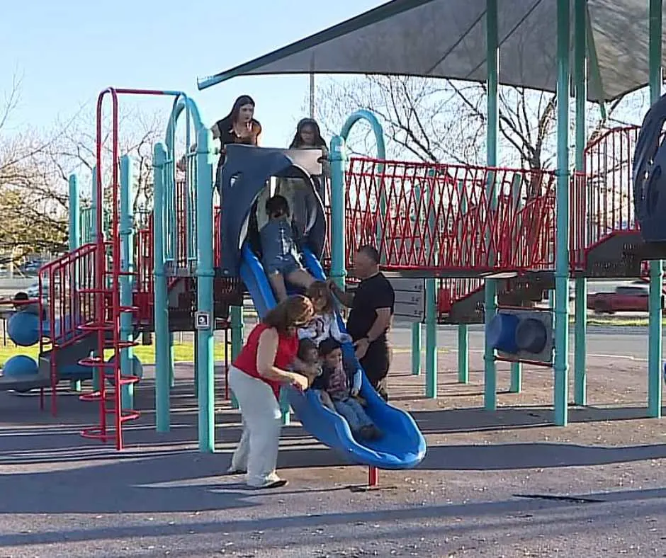 Navaez Family and their five adopted siblings playing at the park.