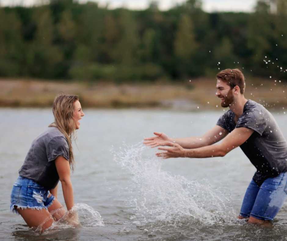 Couple playing on the lake