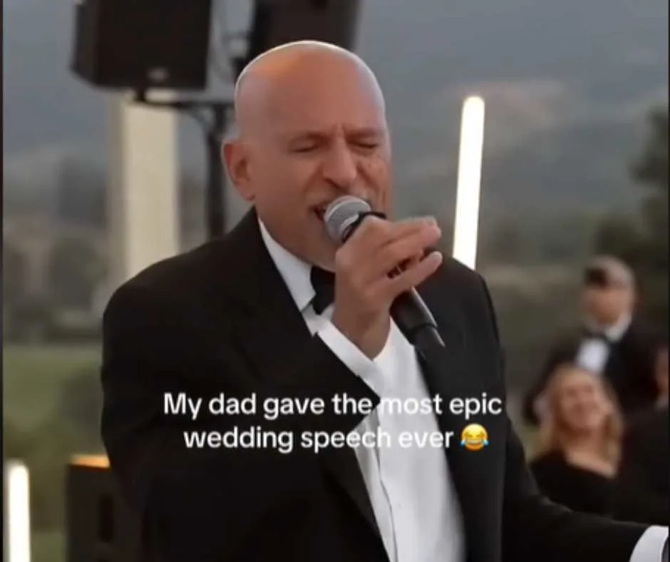 Bruce Miller singing after his speech