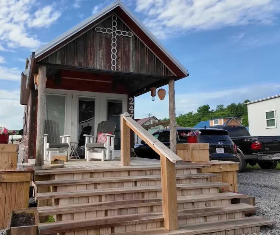 Front view of the house showing the staircase to elevated porch