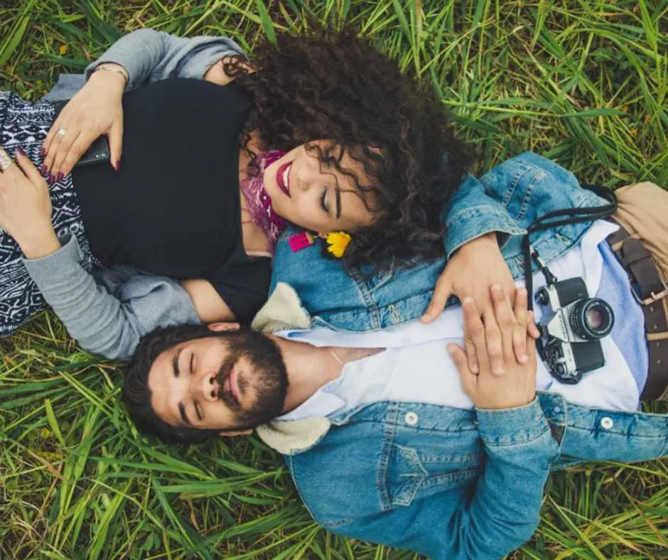 Man and woman lying on grass