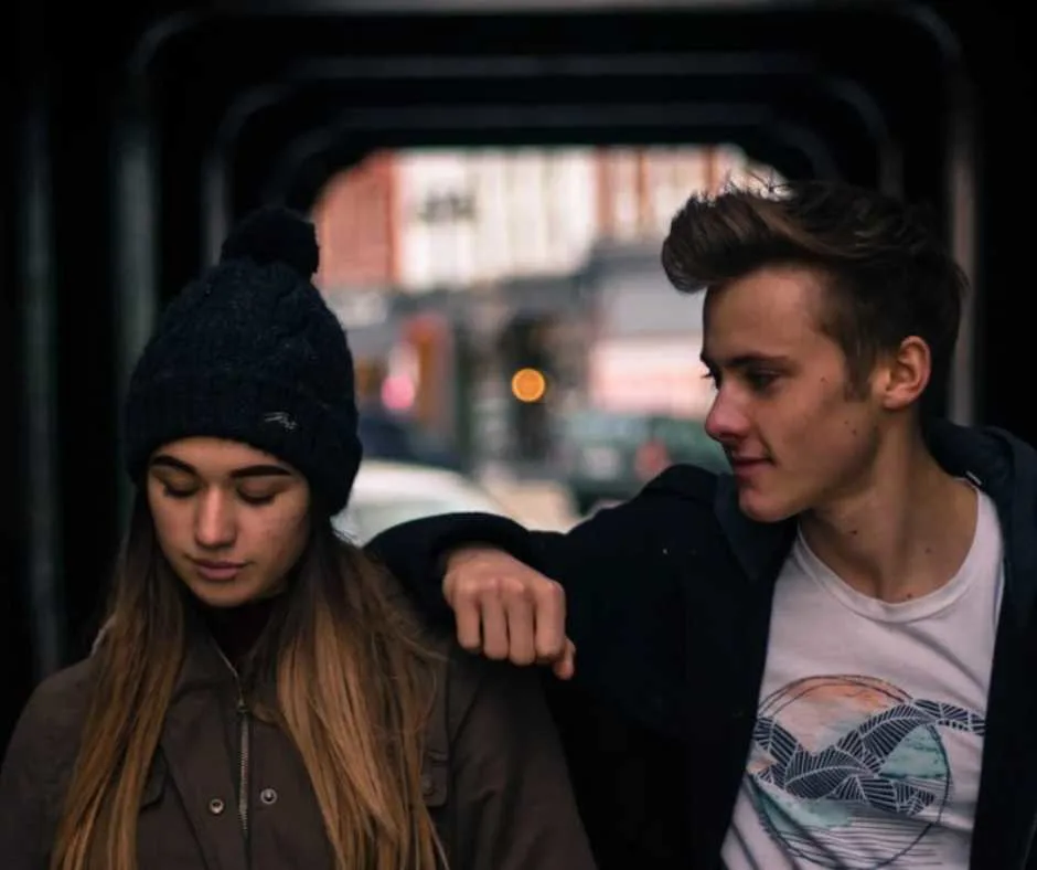 Young couple standing in a tunnel