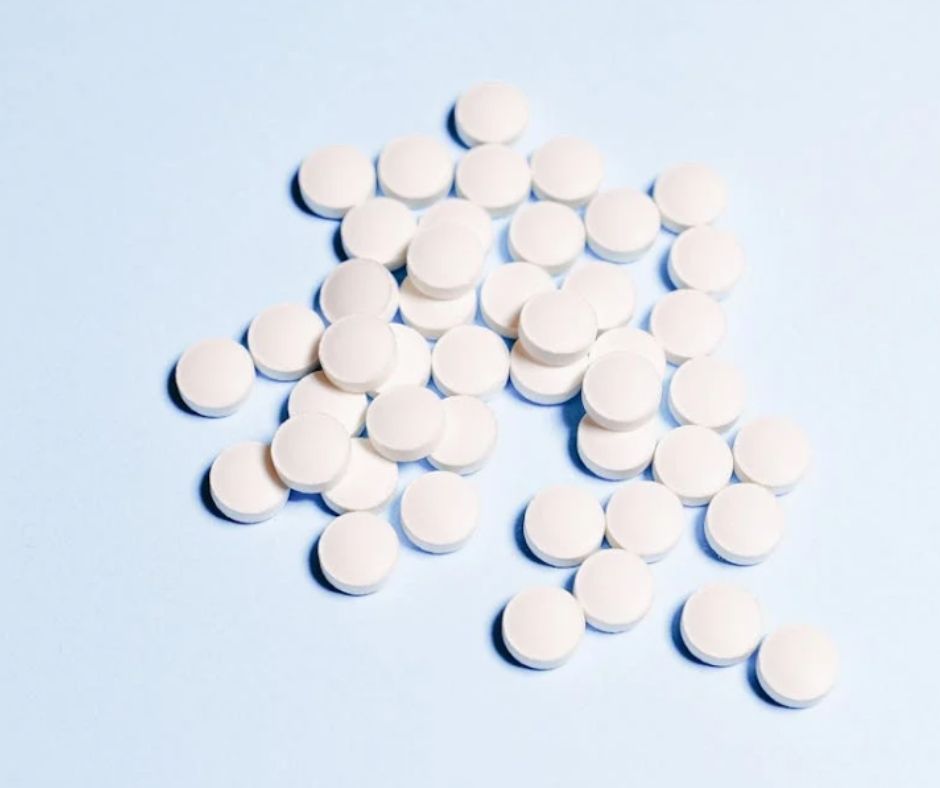 White, round pills resembling aspirin